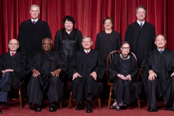 The Roberts Court, November 30, 2018.  Seated, from left to right: Justices  Stephen G. Breyer and Clarence Thomas, Chief Justice John G. Roberts, Jr., and Justices Ruth Bader Ginsburg and  Samuel A. Alito.  Standing, from left to right: Justices Neil M. Gorsuch, Sonia Sotomayor, Elena Kagan, and Brett M. Kavanaugh.  Photograph by Fred Schilling, Supreme Court Curator's Office.
