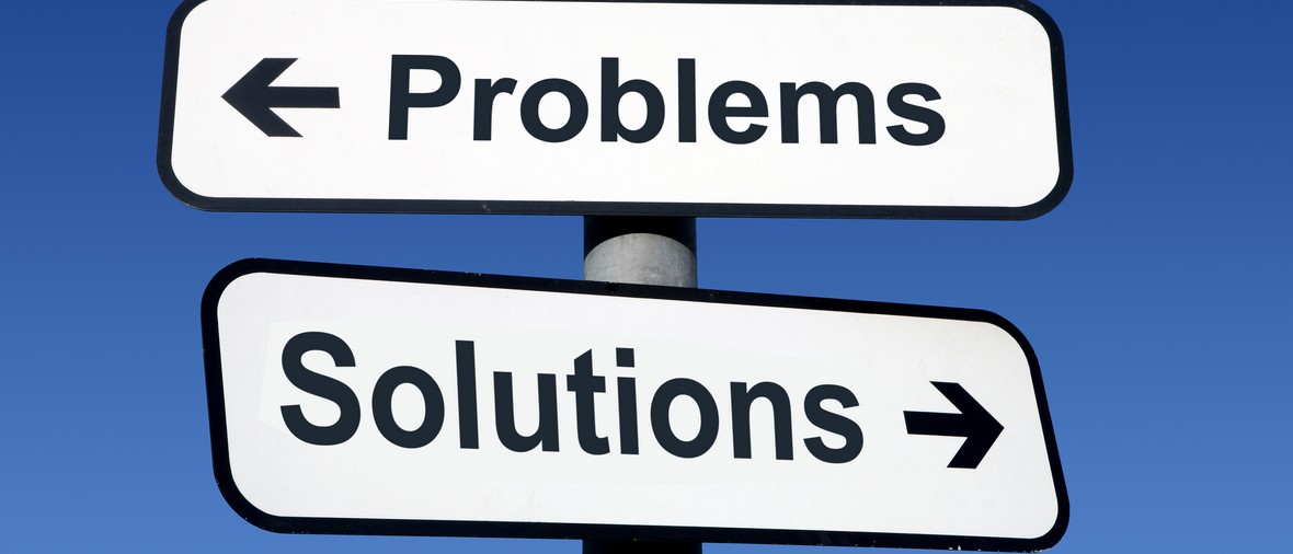 Signpost pointing to problems and solutions.