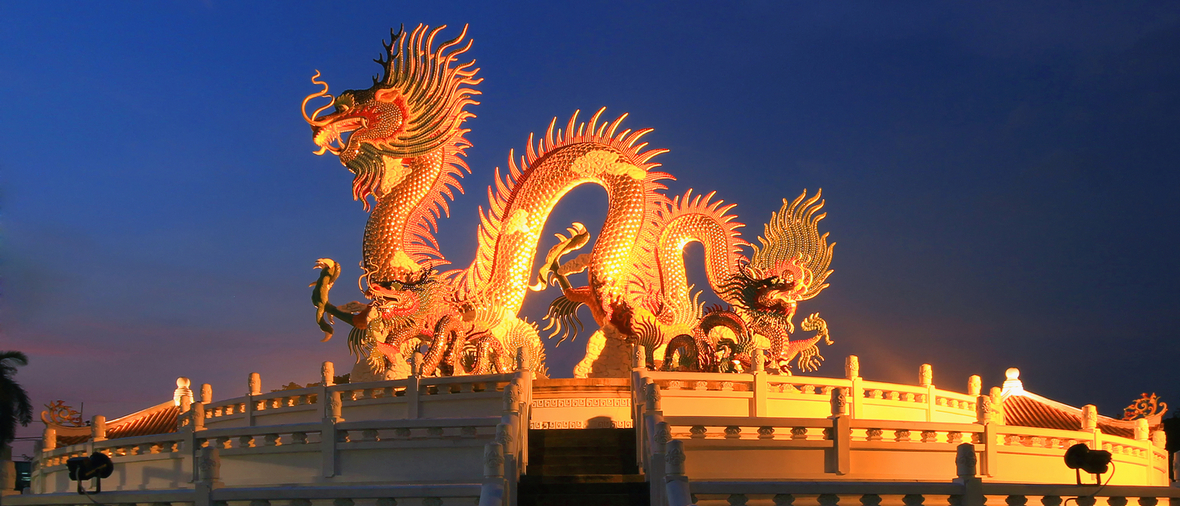 Chinese dragon statue at the twilight time