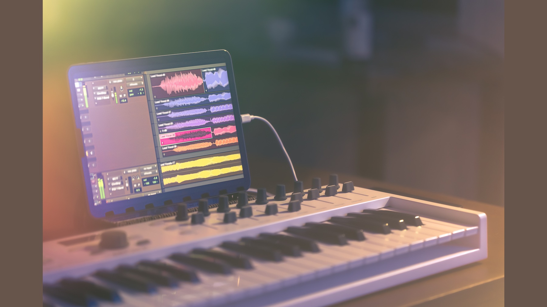 freepik_musical-keyboard-tablet-dark-room-music-production_16x9